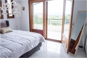 Postel nebo postele na pokoji v ubytování Great Villa Philipi