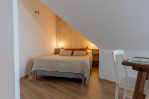 a bedroom with a bed and a staircase at Chambres d'hôtes - Evasion Bretonne in Landerneau