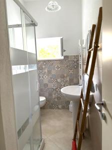 a bathroom with a toilet and a sink at Casa di Mael in Maratea