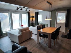 a living room with a table and a couch at Visit Undredal in Undredal