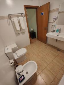 a bathroom with a toilet and a sink at PORTO SANTO MyLove in Porto Santo +42 photos