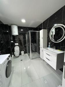 a bathroom with a shower toilet and a sink at VILA Natura Sarajevo in Gladno Polje +24 photos