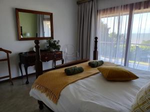 Llit o llits en una habitació de Whispering Waves Villa