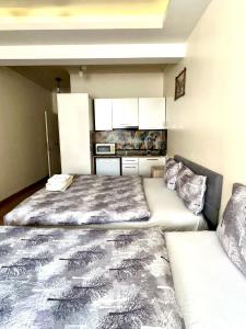 two beds in a small room with at Center Hotel Two in Istanbul