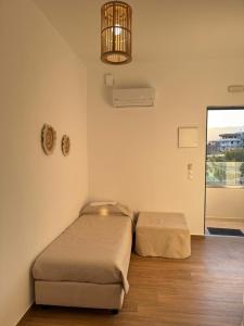 Postel nebo postele na pokoji v ubytování Nikolas Apartments