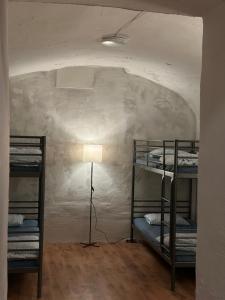 En eller flere senger på et rom på Gate of Dawn by Kliefs Vilnius - Virtual Check-In