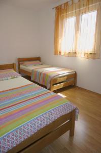 Ein Bett oder Betten in einem Zimmer der Unterkunft Croatian Home Apartments
