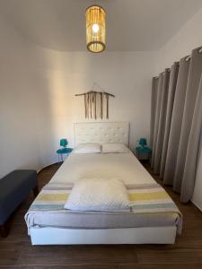 Postel nebo postele na pokoji v ubytování Nikolas Apartments