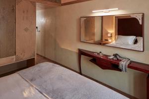 Postel nebo postele na pokoji v ubytování Domus Renier Boutique Hotel