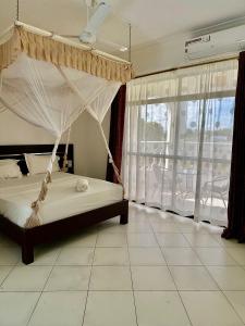 Afbeelding uit fotogalerij van Maskani Diani Beach Apartments in Diani Beach