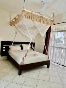 Afbeelding uit fotogalerij van Maskani Diani Beach Apartments in Diani Beach