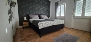 Posteľ alebo postele v izbe v ubytovaní Zara Apartment