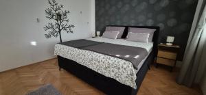 Posteľ alebo postele v izbe v ubytovaní Zara Apartment