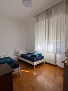 Postel nebo postele na pokoji v ubytování Adriatico 98