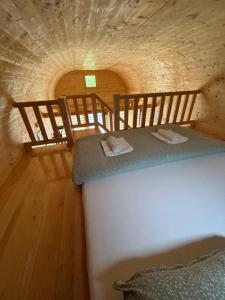 A bed or beds in a room at Apartman Lenka