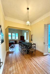 a dining room with a ping pong table in it at Vila dos Ingleses Garden in Santana do Livramento