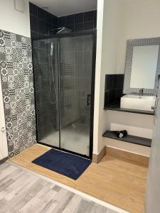 a shower stall in a bathroom with a mirror at Completely renovated house in Heuilley-le-Grand