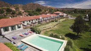 an aerial view of a house with a swimming pool at Hotel Huacalera in Huacalera