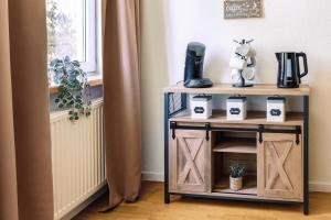 a small table with two doors and a window at Schwarzwald-Flair mit Naturblick & Balkon in Baiersbronn