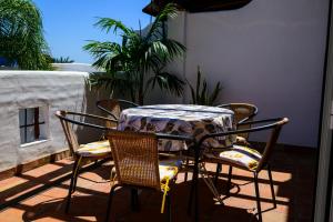 a table and chairs sitting on a patio at Apartment Rincón de Marinos in Almuñécar