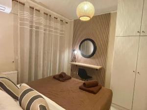 A bed or beds in a room at Ira Apartments