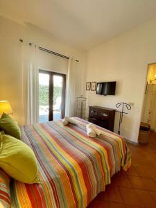 Postel nebo postele na pokoji v ubytování Relais Fontania
