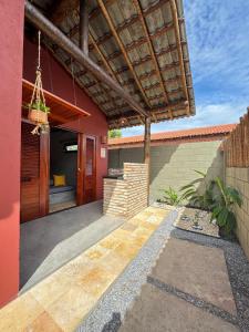 a patio with a pergola on a house at Vila São Jorge in Barra Grande