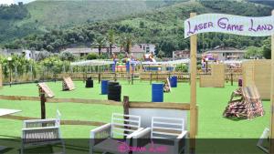 an amusement park with a playground with chairs and slides at Dream Room in Mercato San Severino