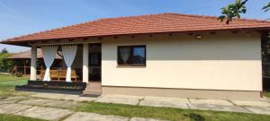 a small house with a red roof at Silence Villa in Satu Mare