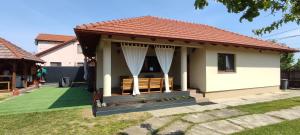 a small house with a red roof at Silence Villa in Satu Mare