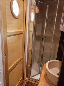 a bathroom with a shower and a sink at Oudoty in Kerlouan +30 photos