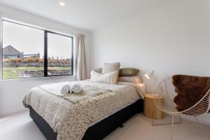 Ένα ή περισσότερα κρεβάτια σε δωμάτιο στο Luxury Lindis Lookout