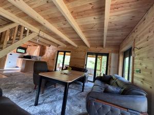 a living room with a couch and a table at Mirsads Mountain Cottage in Plav +56 photos