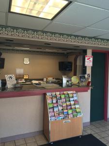 a food counter in a restaurant with avertisement at Express INN in Norfolk