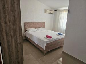 Postel nebo postele na pokoji v ubytování Esko Rooms