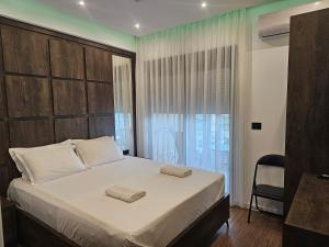 Postel nebo postele na pokoji v ubytování Moon Apartment
