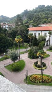 a view of a park with a fountain and trees at Piso centrico en Pravia, con 3 habitaciones sin ascensor in Pravia +3 photos