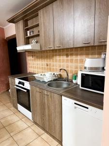 Kuchyň nebo kuchyňský kout v ubytování KK Apartment