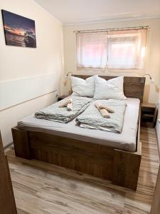 Postel nebo postele na pokoji v ubytování KK Apartment