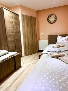 Postel nebo postele na pokoji v ubytování KK Apartment