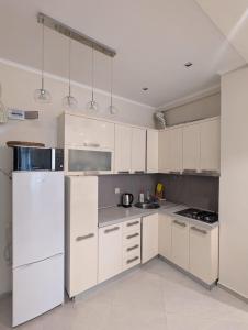 Kuchyň nebo kuchyňský kout v ubytování Cozy seaside apt in Gonio