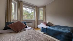 Katil atau katil-katil dalam bilik di Apartament Camelia
