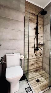 a bathroom with a toilet and a shower at Bella Vista in Bali +153 photos