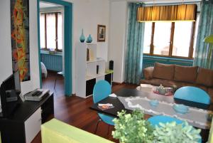 Area soggiorno di Appartements & Chambres Les Loges du Capucin