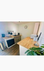 a kitchen with a sink and a counter top at Terre Sauvage Baie de Somme in Abbeville