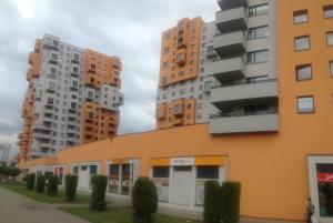 a group of tall buildings in a city at Apartamenty Przymorze in Gdańsk