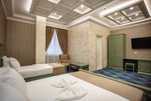 Postel nebo postele na pokoji v ubytování Ervini Boutique Hotel