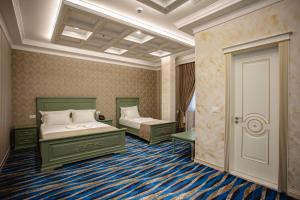 Postel nebo postele na pokoji v ubytování Ervini Boutique Hotel