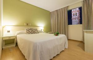Postel nebo postele na pokoji v ubytování Hotel Platería