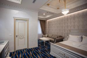 Postel nebo postele na pokoji v ubytování Ervini Boutique Hotel